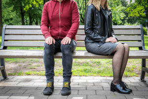 couple on bench not using active listening skills