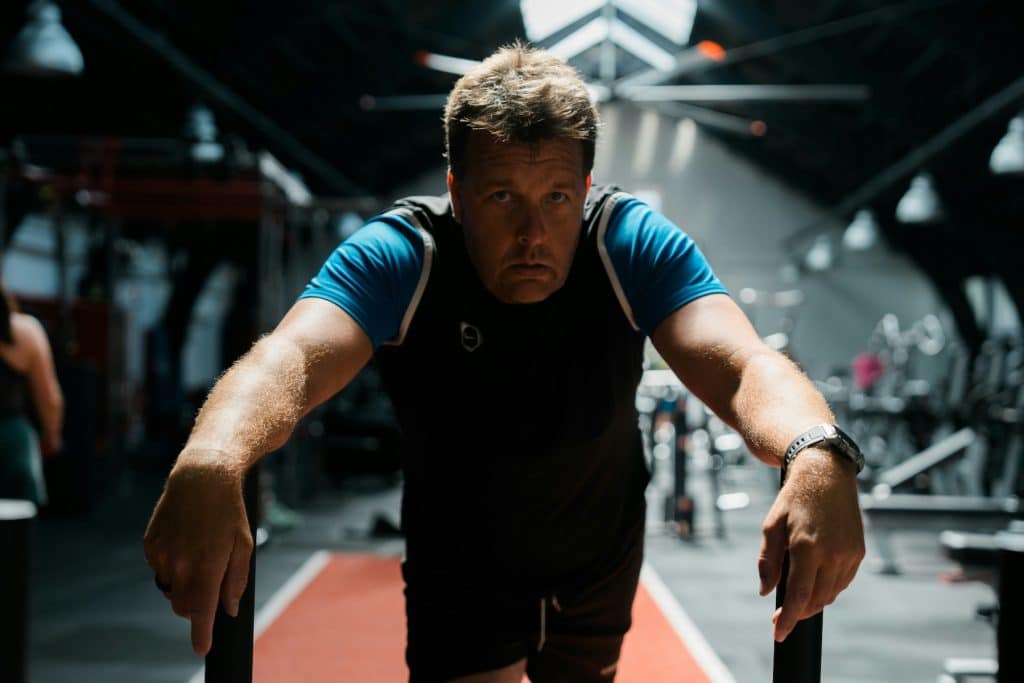 Person exercising despite stress asking does working out help with stress